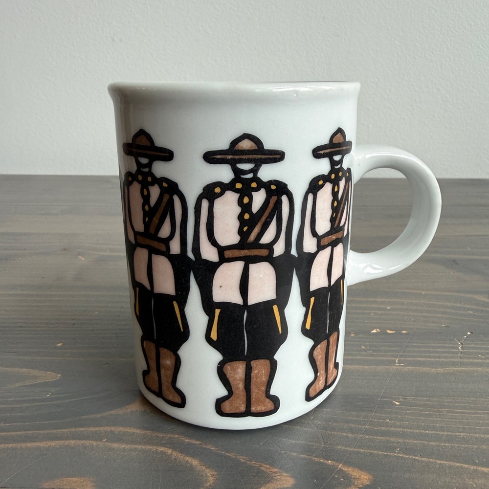 Vintage RCMP ceramic mug designed by Canadian artist Marc Tetro
